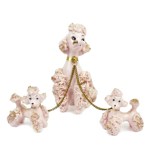 Crafted with love and care, these delightful figurines feature beautiful black and pink poodle dogs surrounded by vibrant...