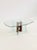 This striking vintage coffee table is a remarkable example of postmodern design from the 1980s . The design plays...