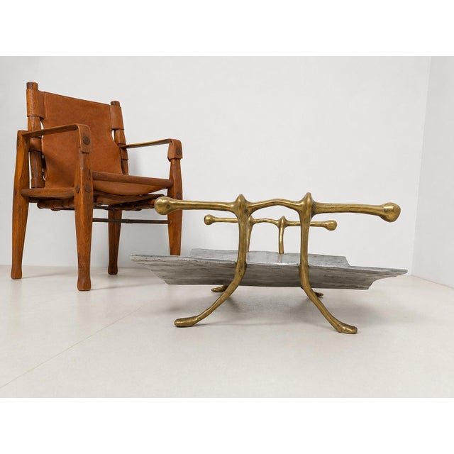 A sculptural rack of contemporary design created by artist and designer David Marshall. Crafted from solid brass and...
