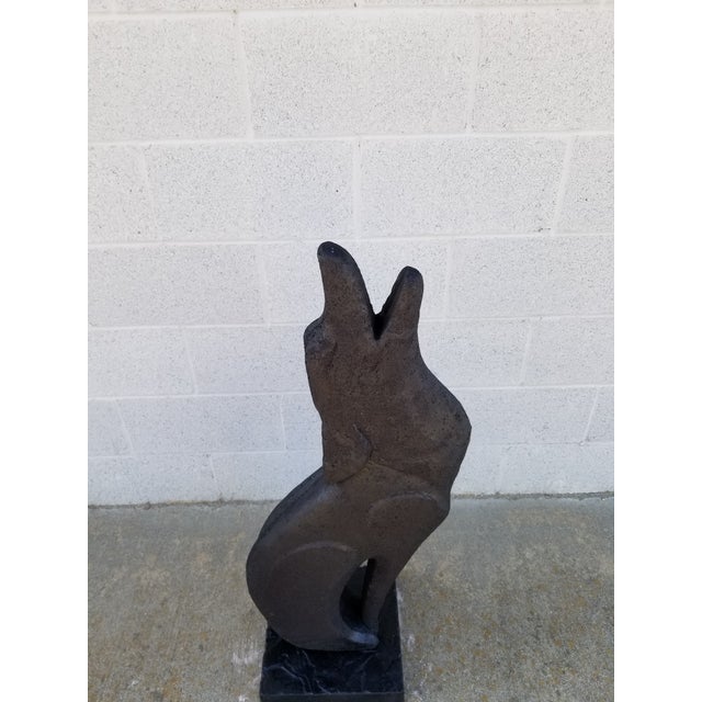 Rare Coyote Sculpture on Pedestal The material is Terracotta finished with a texture in Cement and a Blackish Glaze...