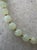 Lovely vintage light green jade beads have been carefully strung and finished with a designer gold tone clasp by Matthew...