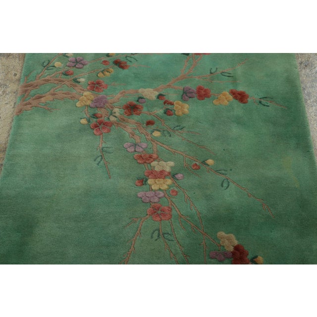 Made with hand-knotted wool and originating from China circa 1920-1930, this 4X5 antique Chinese Art Deco Rug is a rare...