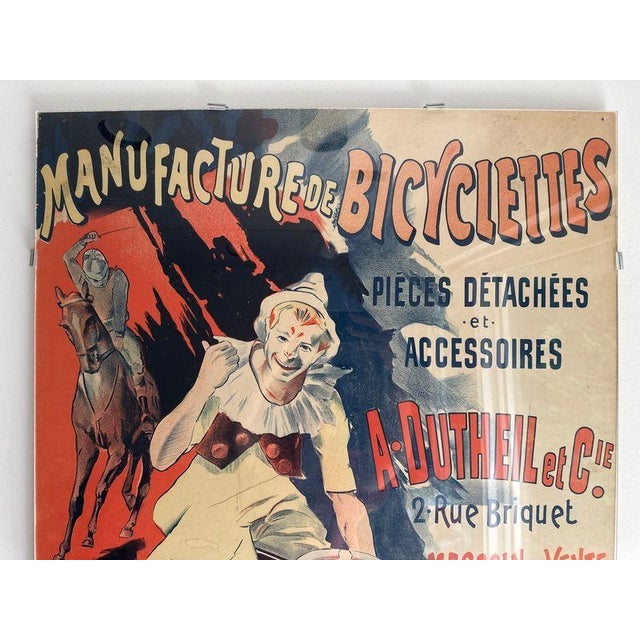 The product is a vintage poster from late 1800's titled "Manufacture de Bicyclettes A. Dutheil et Cie" featuring a theme...
