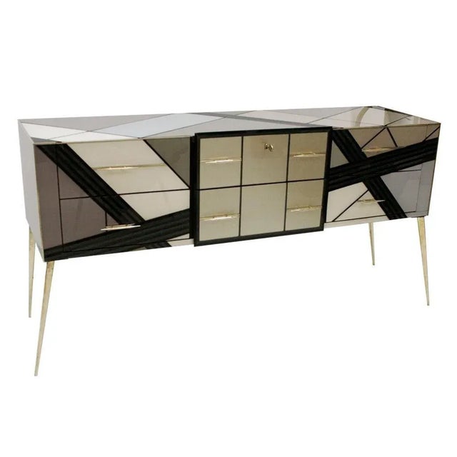 Italian sideboard made of solid wood structure from the 1950s and covered in Murano colored glass. Composed of six drawers...