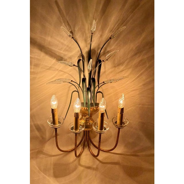 An extraordinary and elegant pair of four-arm wall sconces by banci firenze, a renowned maker from florence celebrated...