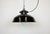 Industrial enamel hanging lamp made in former Czechoslovakia during the 1950s. It features a bakelite top, a black enamel...