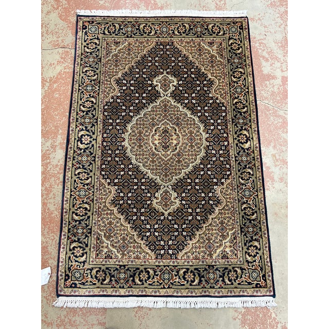 Persian Tabriz Mahi Fish rug, hand-knotted in India from 100% wool. Measuring 2’7” x 4’1”, the rug features a traditional...