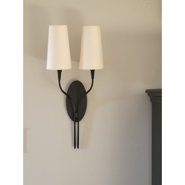 This beautiful sconce boasts simple lines and an Old Bronze finish. It will easily transition into your decor...