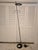 A vintage minimalistic floor lamp mid century modern inspired in a sleek black patina. Having a floating style UFO halo...