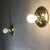Set of two gold wall lamps with a 1960s design. Gold-plated aluminum frame. They use a large E27 bulb. Fully functional...