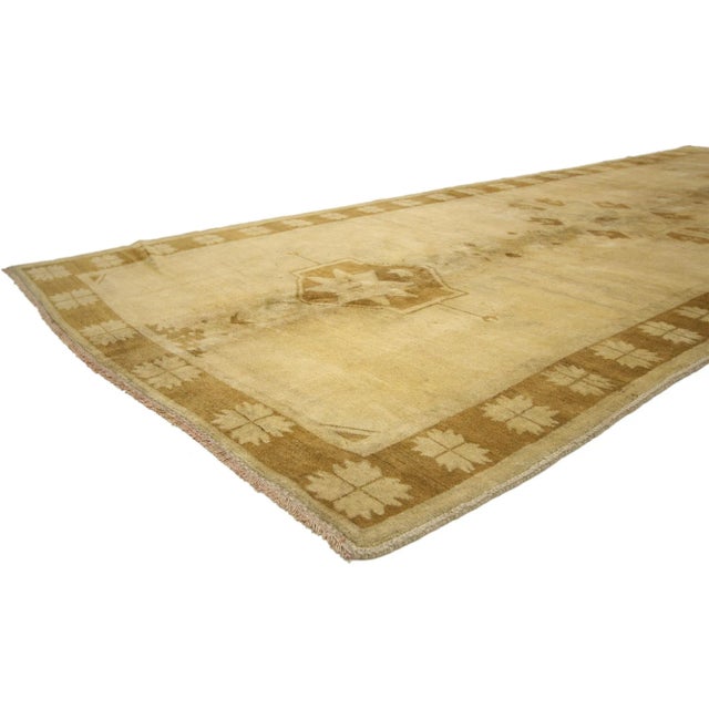 Warm and Neutral Vintage Turkish Oushak Gallery Rug, Wide Hallway Runner 05'00 x 12'02. Soft and lustrous, the beauty of...
