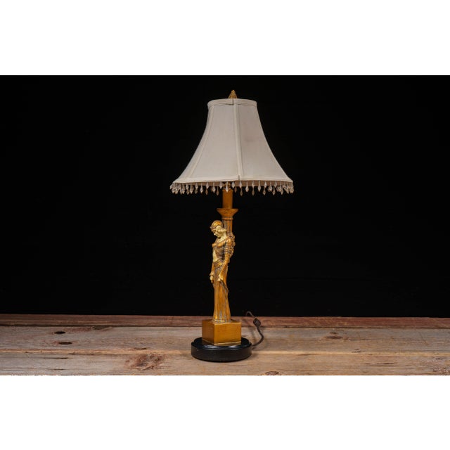 Late 20th-century Art Deco Revival table lamp executed in the manner of Demétre Chiparus and inspired by the...