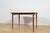 The rectangular table produced in the 1960s in Scotland by A.H. McIntosh. It is made from teak. The furniture has profiled...