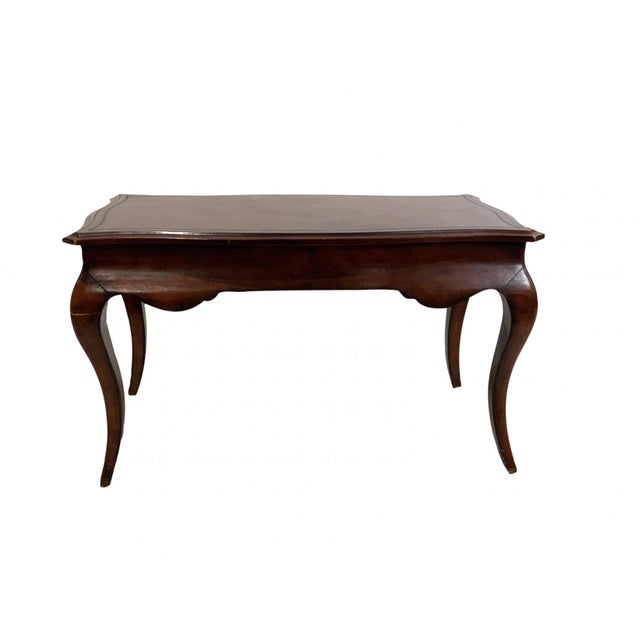 A rich reddish-brown leather wrapped in French Louis XV style writing table or desk with a rectangular serpentine-shaped...