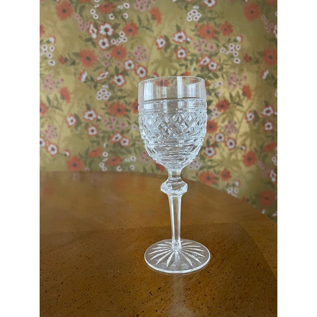 This is a water goblet in the Castletown pattern that has vertical and horizontal cuts along with thumbprints. These...