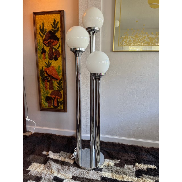Brighten your home with this striking Vintage Mid‑Century Modern chrome floor lamp, a stunning piece of functional art...