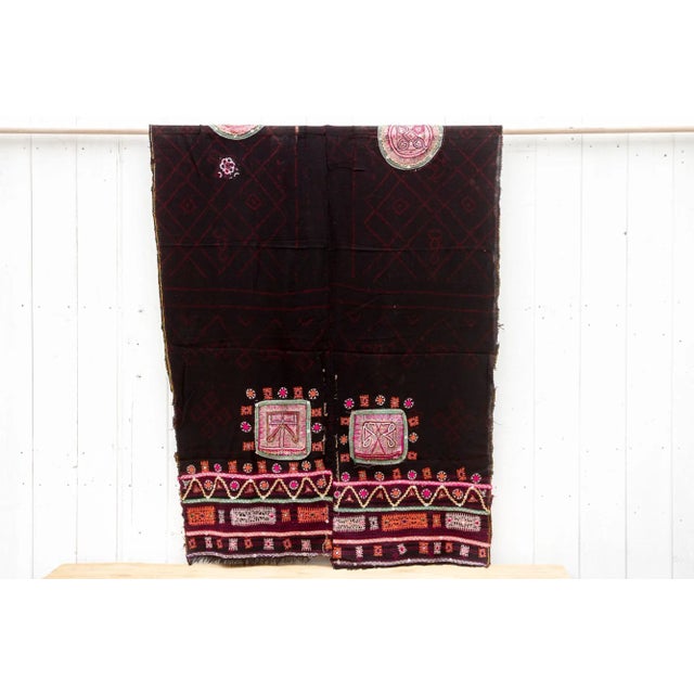 A captivating vintage Rabari throw, directly sourced from Gujarat, India, is a unique piece that tells a story. Hand-woven...