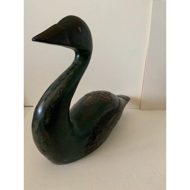 Marvelous hand made folk art decoy carving of a goose. Metal tooled and stamped embellishments on back. Wings are hand...