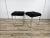 Pair of 1970s stools or ottomans with a chromed metal frame and black fur-covered seat. The chrome plating shows some...
