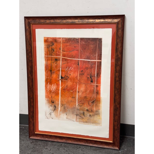 Design Plus Gallery presents a Custom Framed Abstract Mixed Media Artwork. In a vivid orange palette with gestural line...