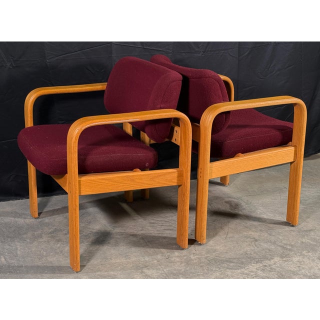 This pair of lounge chairs by Milo Baughman for Thayer Coggin features bentwood oak frames with the clean continuous...