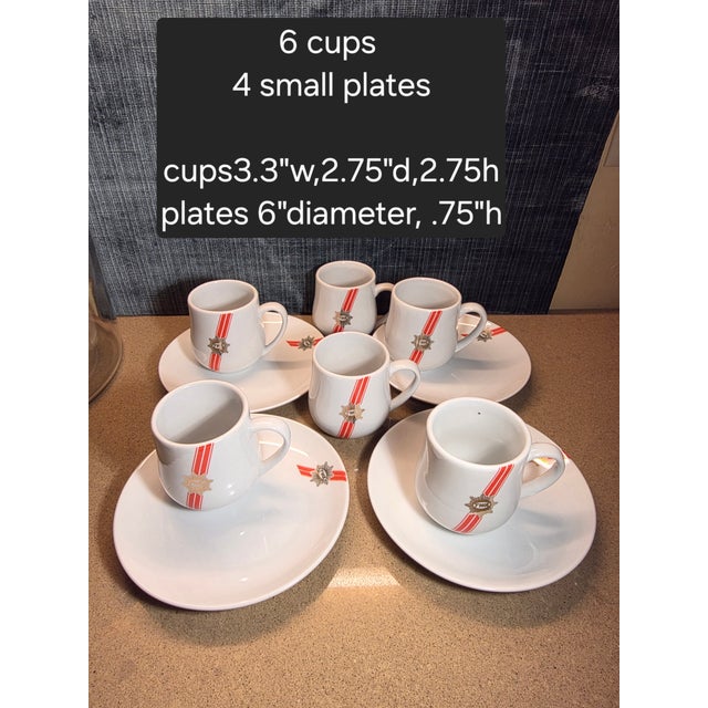 Vintage TWA airline cups and small plates. Six cups and four plates.