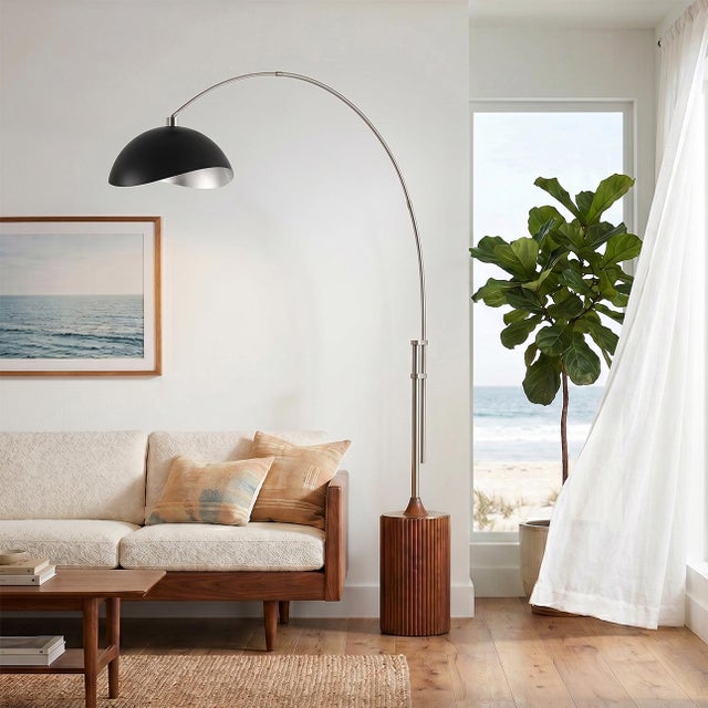 The Tambo Arc Lamp is a Mid-Century Modern masterpiece designed by Peter Morelli in 1984, showcasing NOVA of California's...