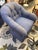 This is a club chair. It also is able to swivel. It is made by Kravet furniture. It has a woven linen fabric in a blue...