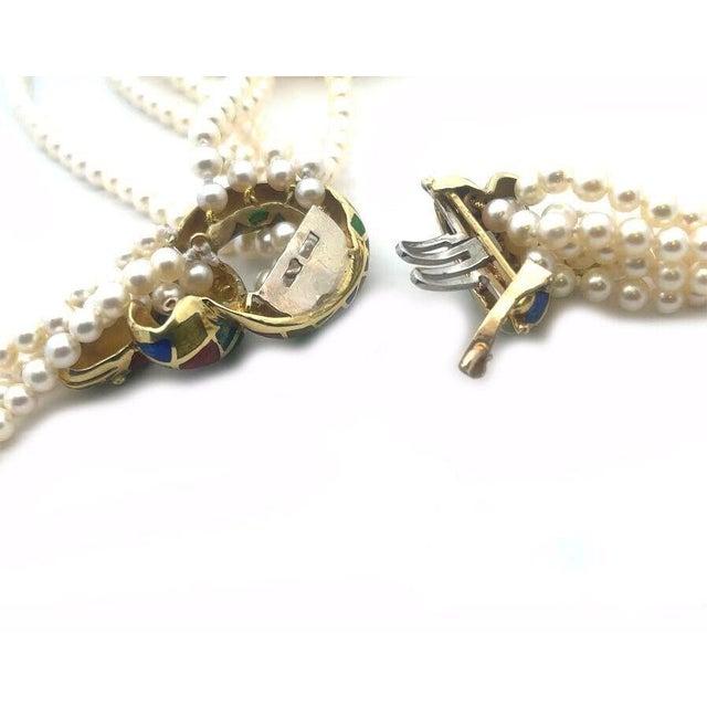 This is a majestic pendant and multi-strand pearl necklace, the pendant is crafted from 14k yellow gold featuring a...
