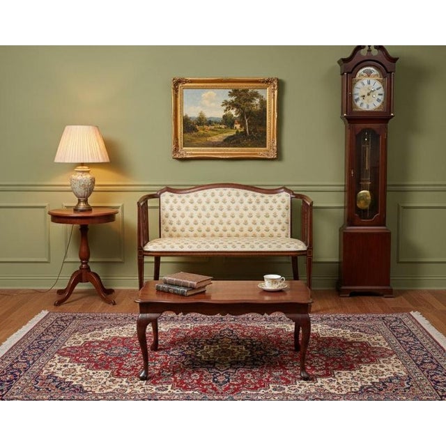 Elegant two-seat sofa or bench crafted in mahogany, likely from the early 1900s. The piece features graceful Art Nouveau...