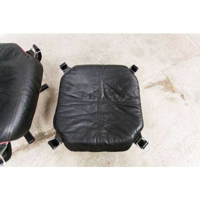 Viking armchair set p97 by Sigurd Ressell for Poltrona Frau 1980 with its ottoman. Both pieces are signed. The leathers of...