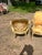Elegant pair of 19th-century French Louis XVI armchairs, crafted from carved and painted walnut with fluted legs and...