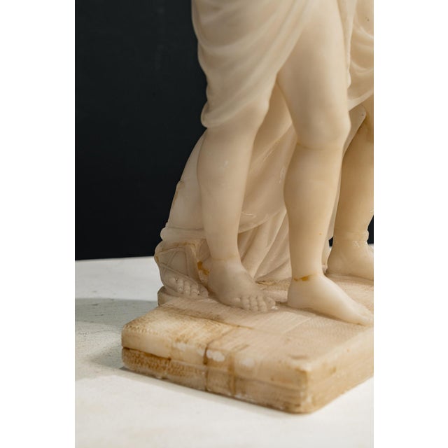 A sculptural pair in the round depicting the stroll between the god Bacchus and Ariadne. Bacchus encircles Ariadne with...