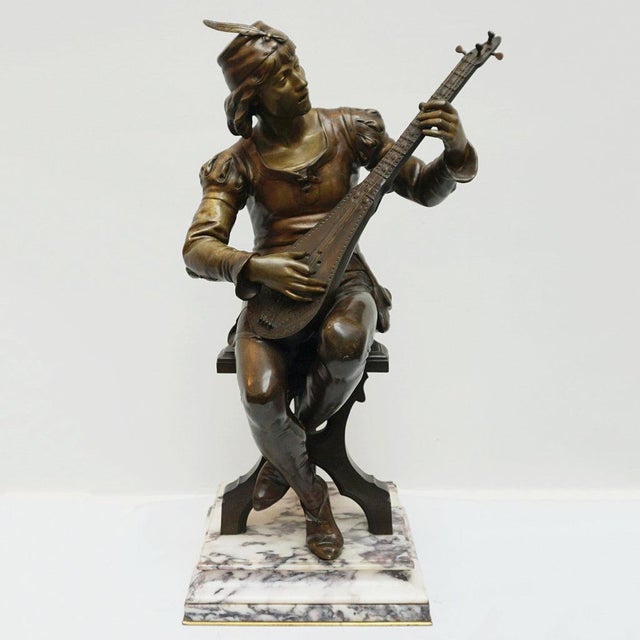 Seated minstrel' a late 19th century bronze sculpture by emile boisseau (1842-1923) depicting a seated troubadour in...
