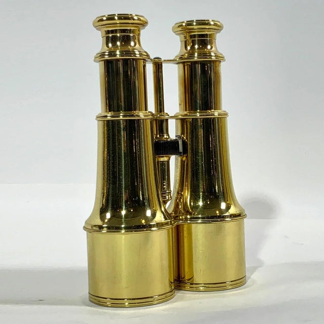 Pair of highly polished and lacquered French made yachting binoculars with engraved eyepieces "Lemaire Fab, Paris". With...