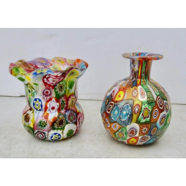 Venetian millefiori glass vases. Two cabinet vases of millefiori glass, one with gold fleck glass and the other made of...