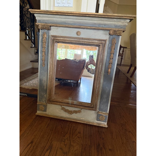 French style decorative mirror with gold accents. Painted in a light grey blue and a darker blue.
