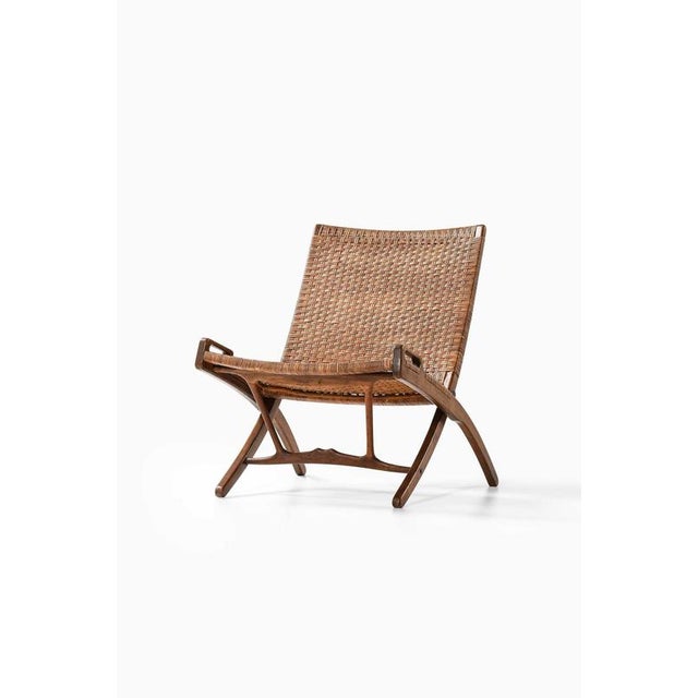The jh-512 folding chair is an early and rare model designed by hans j. Wegner and produced by cabinetmaker johannes...