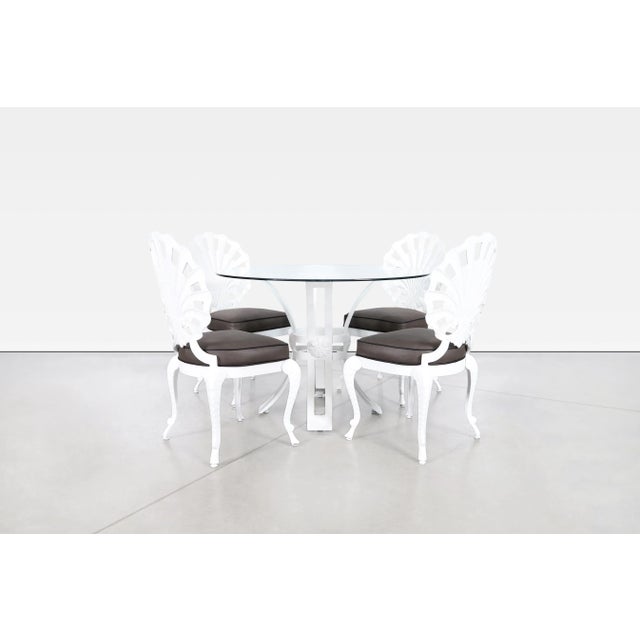 This striking vintage dining set captures the glamorous spirit of 1970s coastal and Hollywood Regency design. Long...