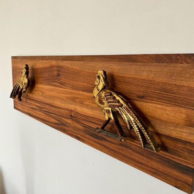A Chinoiserie wall art composition composed of two antique Chinese giltwood pheasant carvings, salvaged from a larger bed...