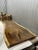 One tree. One top. One of one. A true single-slab live edge table: one continuous cross-section of a single Saman tree...