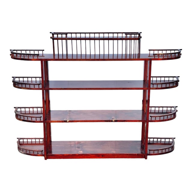 A show stopping, one-of-a-kind folk craftsman wood shelf featuring five tiers with extensive peg railing. Sturdy...