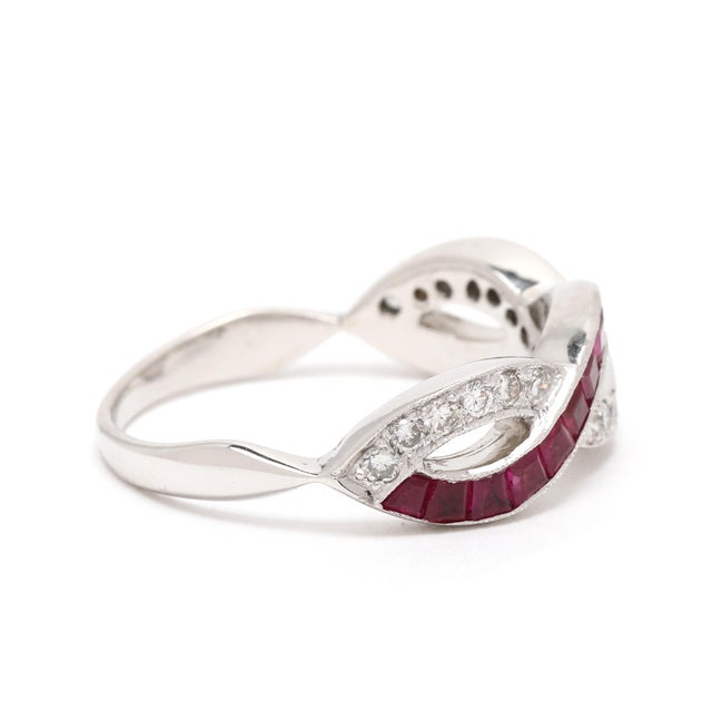Stones: diamonds, 19 stones round brilliant cut 1.6 mm approximately .30 total carats F-G color, VS2-SI1 clarity ruby, 16...