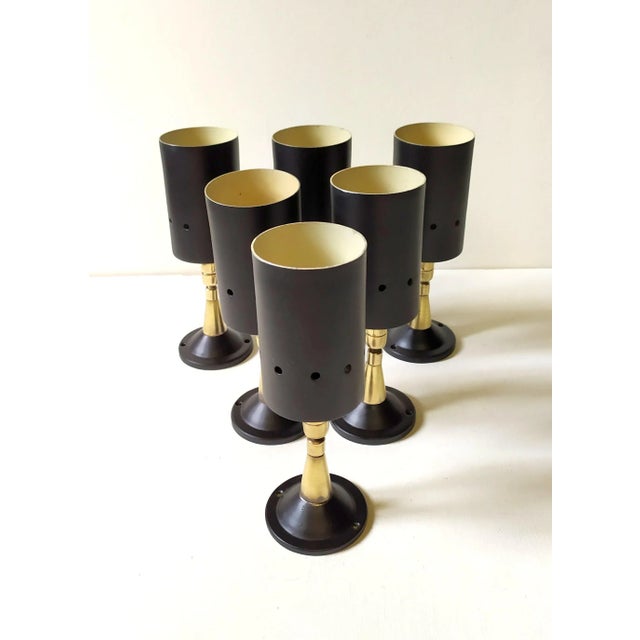 The spotlights are attributed to Stilnovo for form and style. No mark and label. The seller guarantee the originality of...