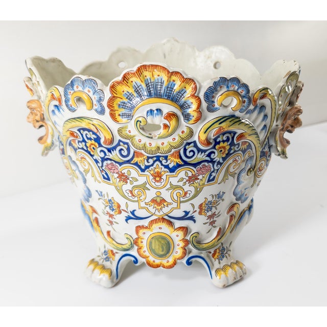 We are selling this great looking French centerpiece jardiniere. This Rouen Faience planter has great look with great mask...