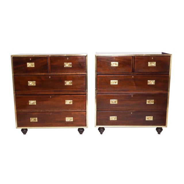 Impressive pair of English antique five drawer campaign chests crafted in mahogany in a two piece construction with brass...