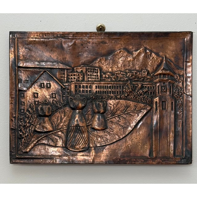 A rustic European scene of a peaceful village, traditional architecture towers and mountains with either along with...