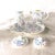 This isa blue floral set by David Michael China of England with pink bows in it. The set consists of a teapot and lid,...