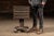 Compact painted-wood cabinet constructed as a square storage box mounted on a turned pedestal base with four scrolled...