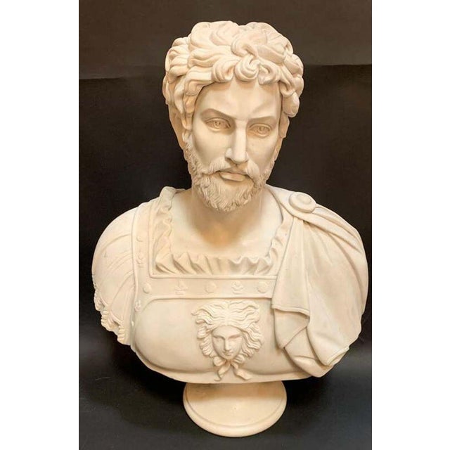 A graceful Italian marble bust depicting the Roman emperor Marcus Aurelius, finely carved in luminous Carrara white marble...